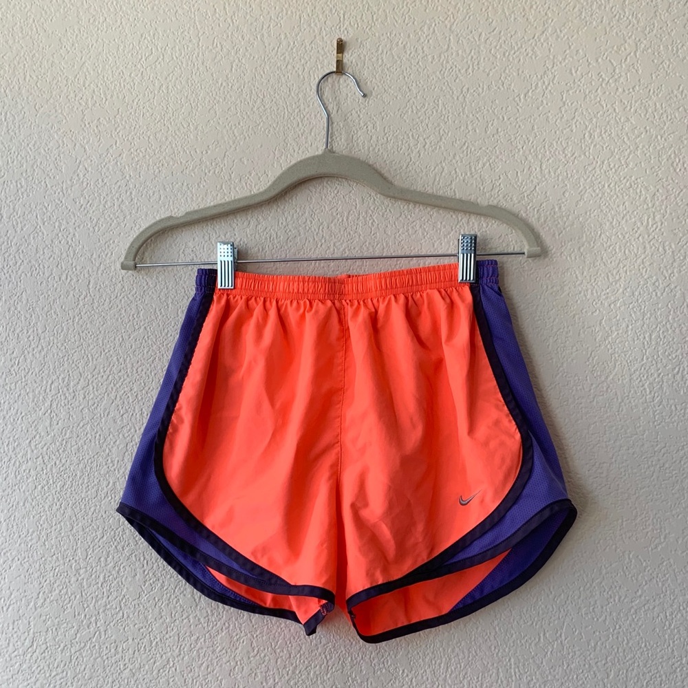 Fluorescent pink and purple Nike Dry-Fit shorts